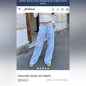 BLUE AND WHITE STRIPED PANTS. Subdued coulisse